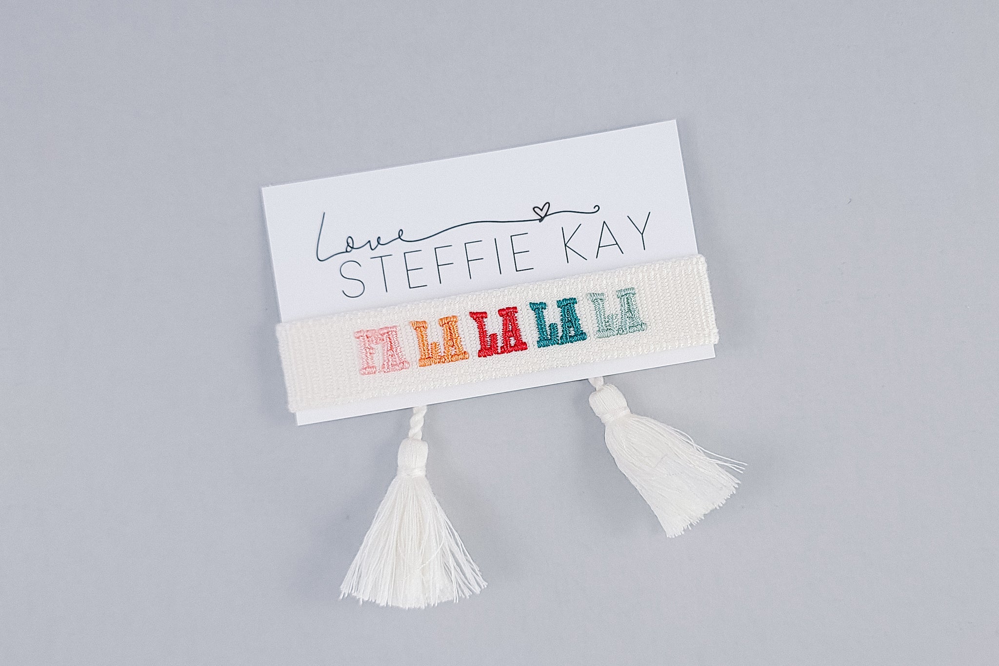 Embroidered Tassel Bracelet | Fa La La La La